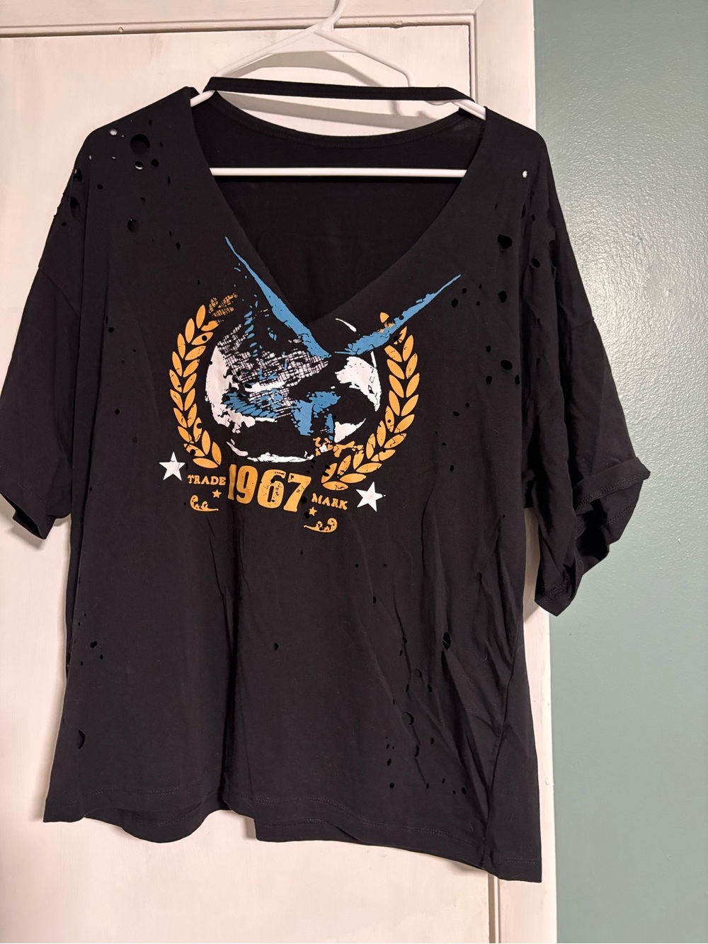 SHEIN Black Distressed V-Neck Graphic Tee with Yellow Crest